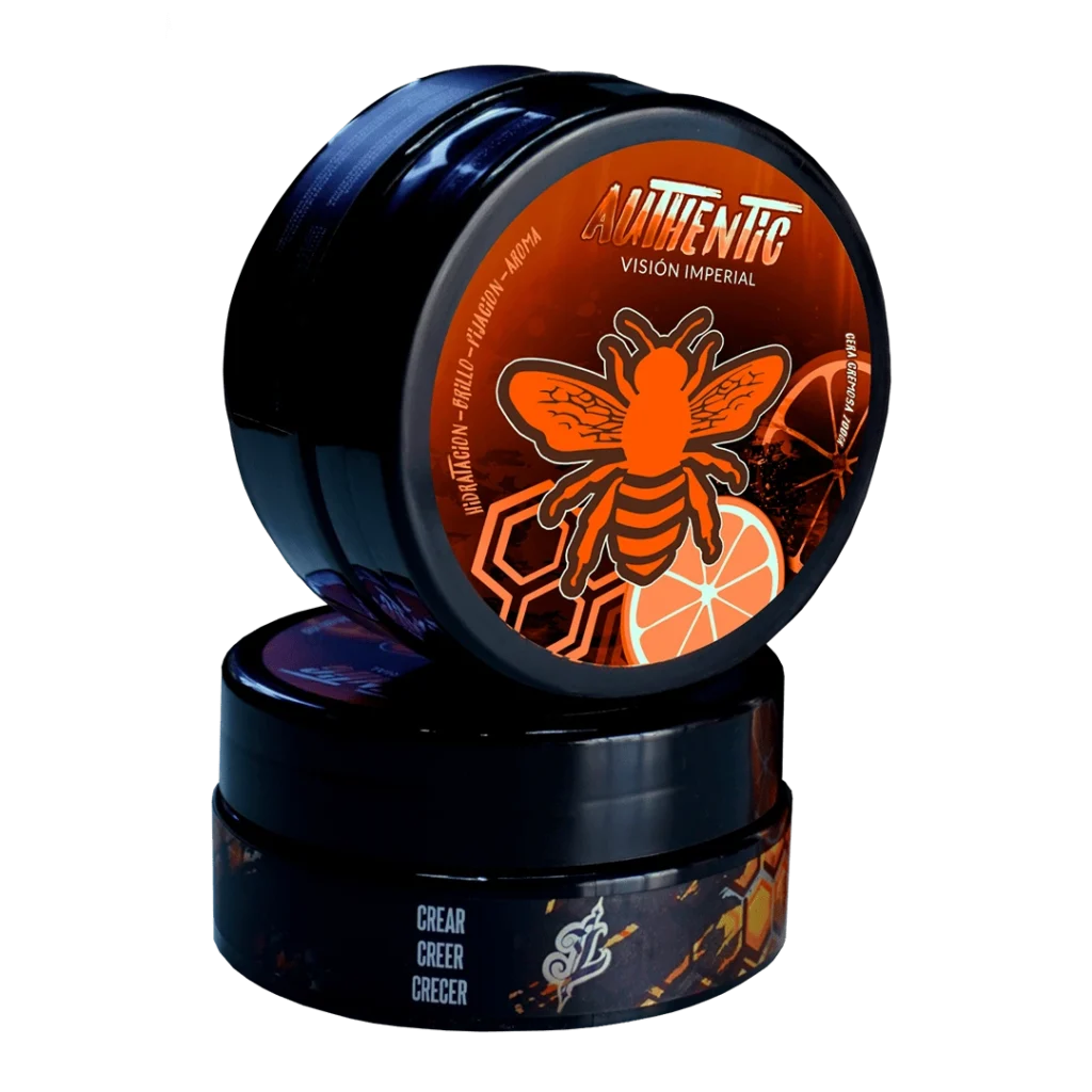 Cera Cremosa Authentic Vision Imperial con diseño naranja y negro, apilados para mostrar la tapa y el lateral.